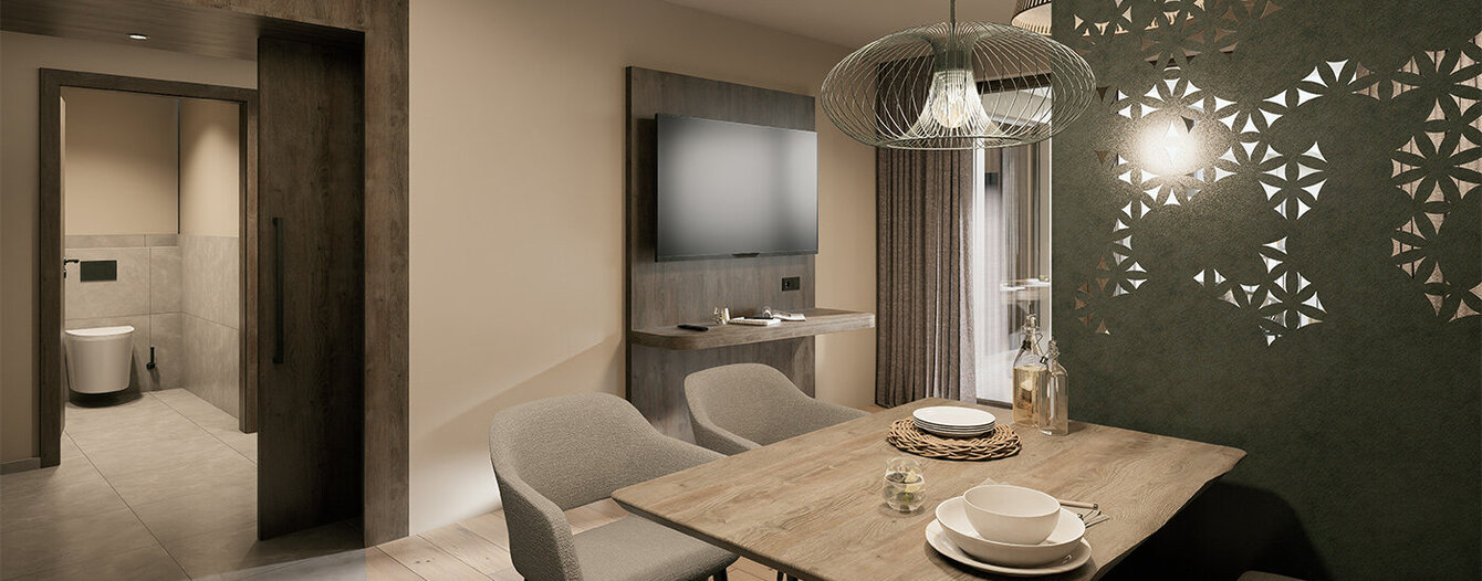 Moderner Essbereich mit einem Holztisch, gepolsterten Stühlen und einer Bank. Darüber hängen sanfte Hängelampen, und eine dekorative Wand mit ausgeschnittenen Mustern sorgt für Stil. Neutrale Farben schaffen eine gemütliche, elegante Atmosphäre.