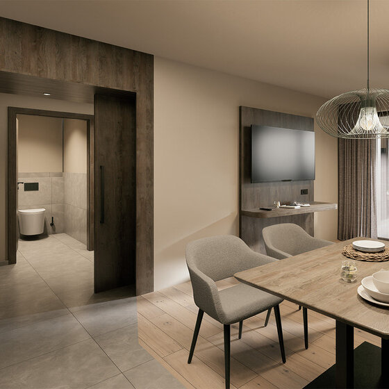 Modernes Badezimmer mit einem runden, hinterleuchteten Spiegel über einem Waschbecken mit Steinplatte, einem Waschtisch mit Regalen für Handtücher und einer glasumschlossenen, begehbaren Dusche mit beigen Steinwänden und einer eingebauten Duschnische.